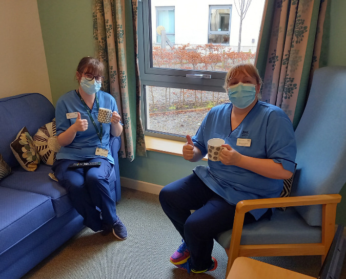 NHS Staff sat together in the wellbeing space drinking a coffee