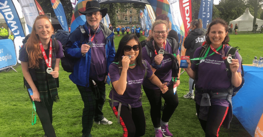 Kiltwalk participants at the finish line with their medals