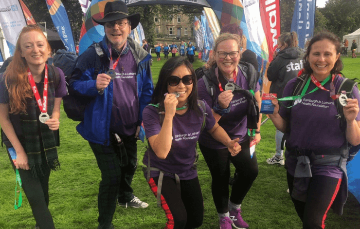 Kiltwalk participants at the finish line with their medals
