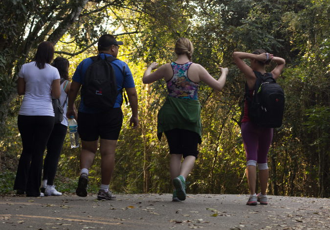 Five people walking in a group