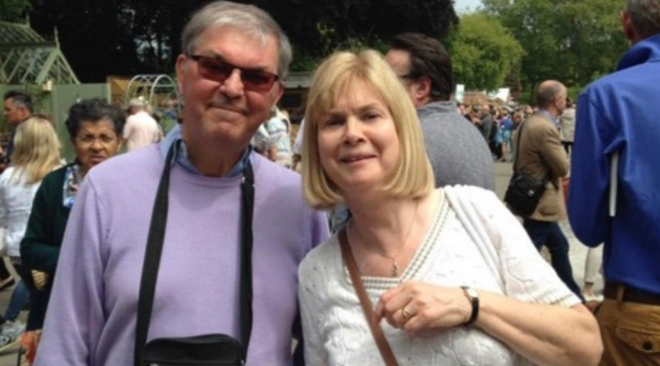 Alan and his wife Flora smiling at the camera