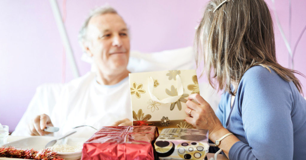 A patient in hospital receiving Christmas presents