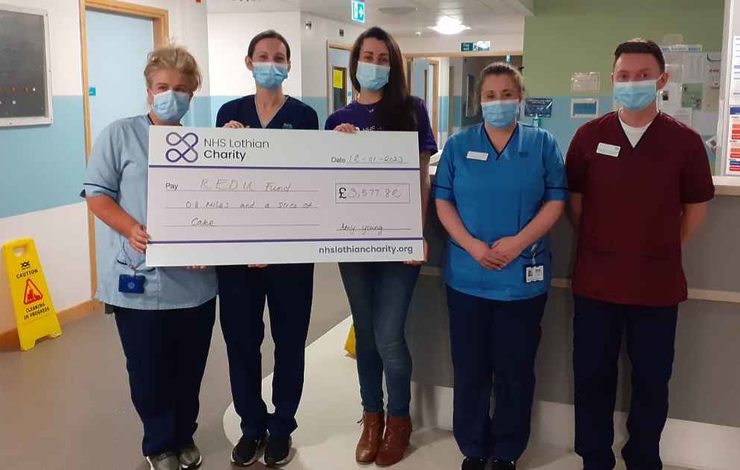 Amy Young, NHS Lothian Charity Fundraiser, presenting a check to REDU, St John's