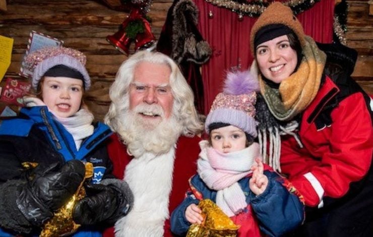 Lorna Forsyth and her daughters meeting Santa during the annual FACE visit to Lapland at Christmas to support families who have been impacted by cancer