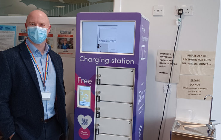 Andy Mackay, Site Director at St John's Hospital stood by the new charging point in A&E