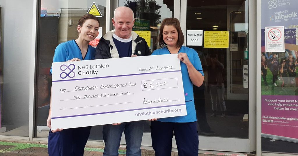Andrew presents a cheque to NHS Lothian staff at Edinburgh Cancer Centre