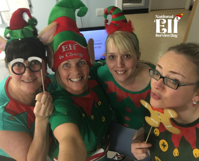 NHS staff smiling at the camera dressed as elves for the National 'Elf Service