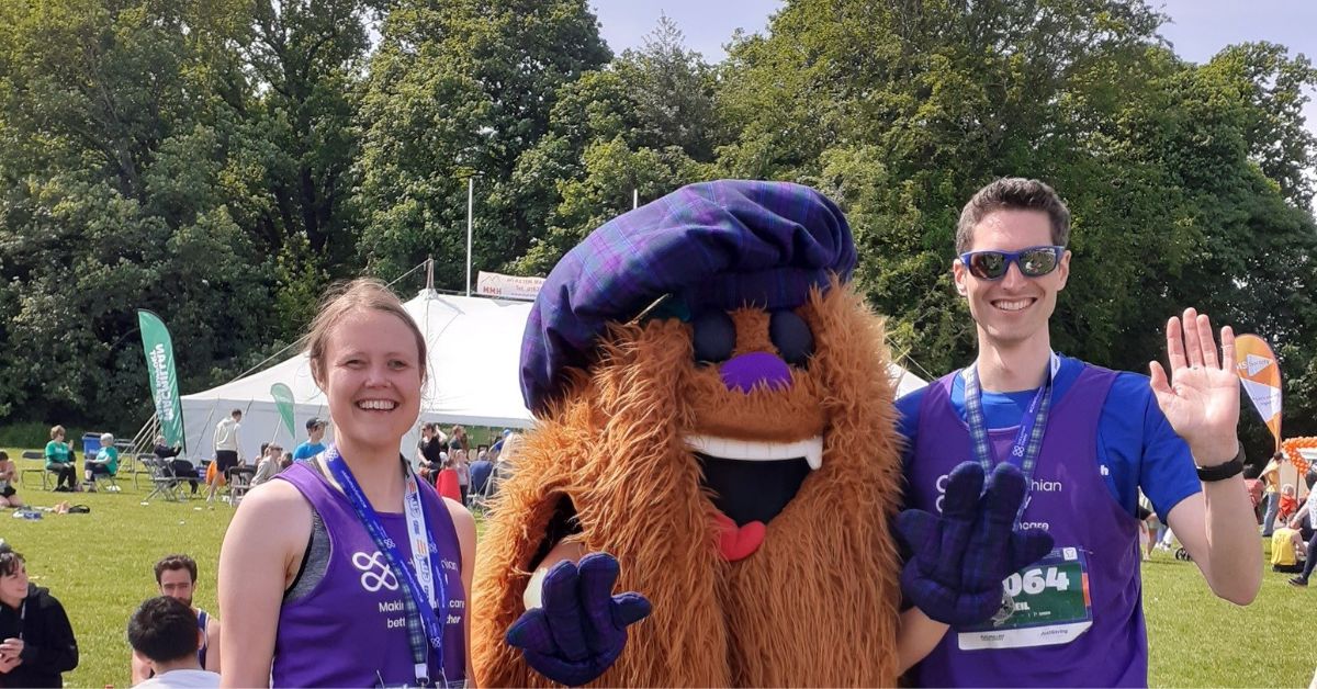 Two NHS Lothian Charity runners with EMF's mascot, the Hairy Haggis