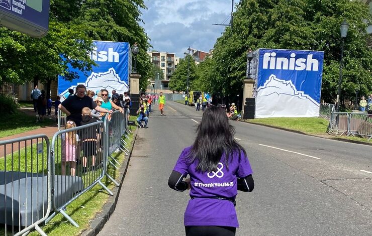 NHS Lothian Charity runner approaching the finishing line at EMF