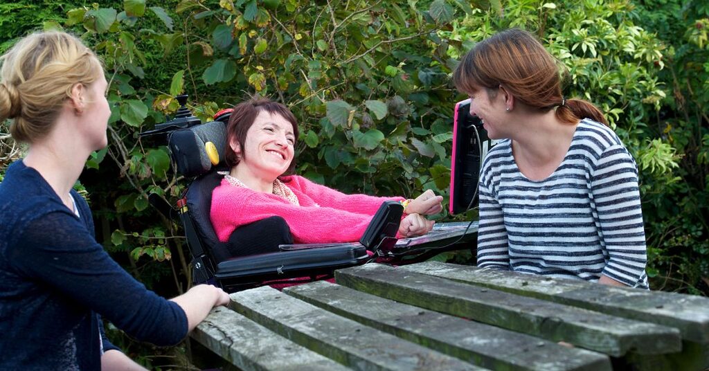 Staff and patients laughing outside