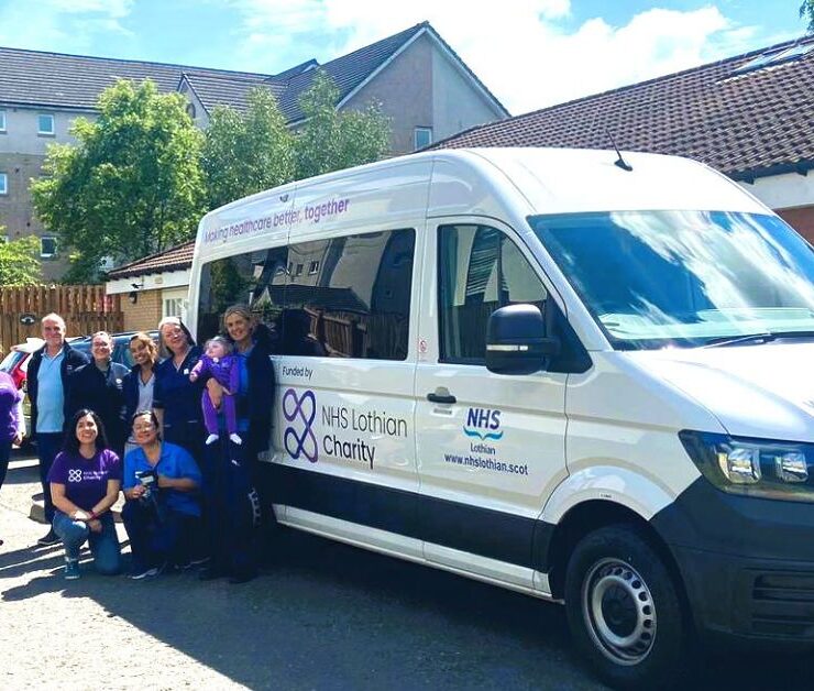 Teams from NHS Lothian Charity and Sunndach and Calareidh standing beside the new adapted minibuses