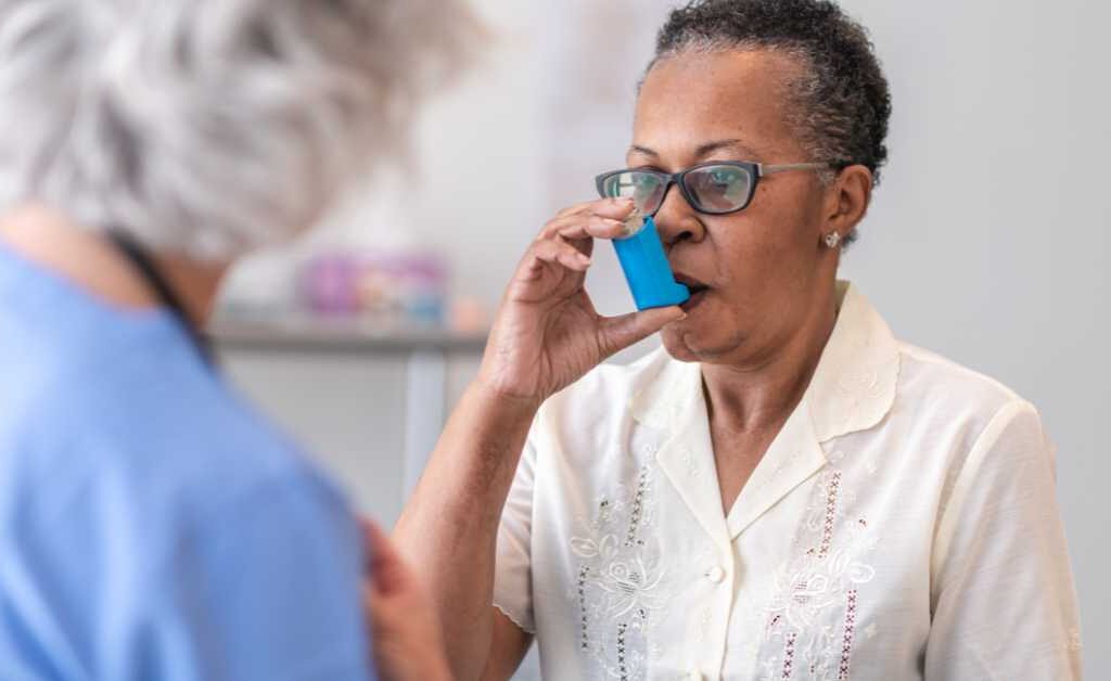 woman using an inhaler