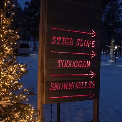 A directional sign in Lapland at Christmas during the FACE annual trip to support families impacted by cancer