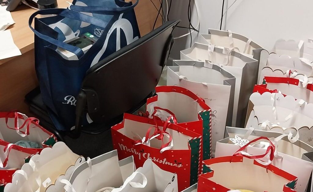 Bags of Christmas presents in an NHS Lothian office waiting to be handed out to patients. Linked to Michele's story