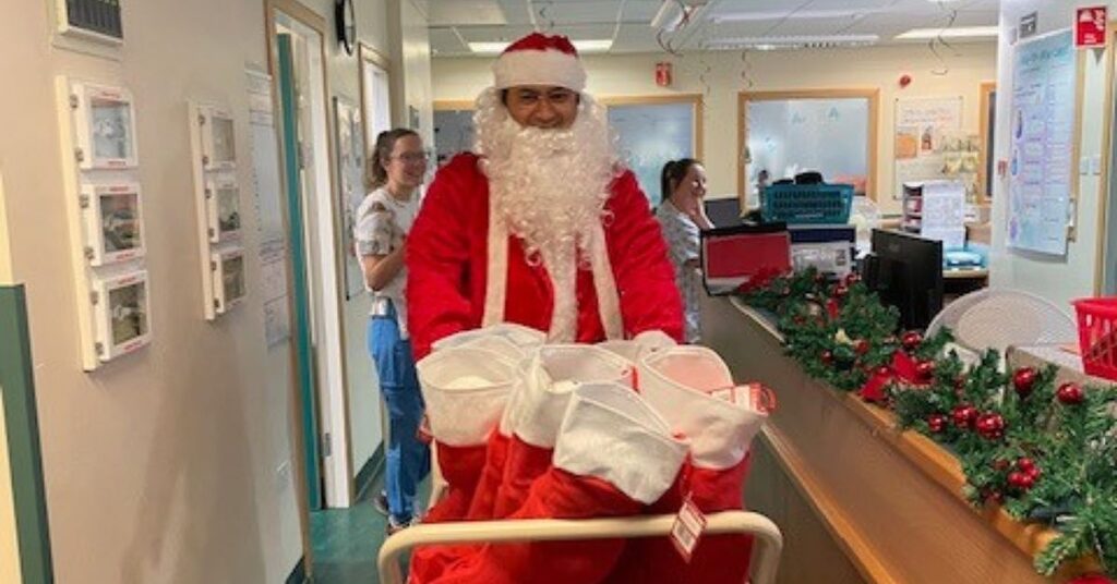 NHS staff dressed up as Santa delivering presents to children too unwell to go home for Christmas