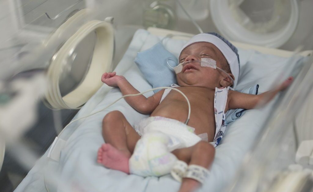 Newborn baby in an incubator