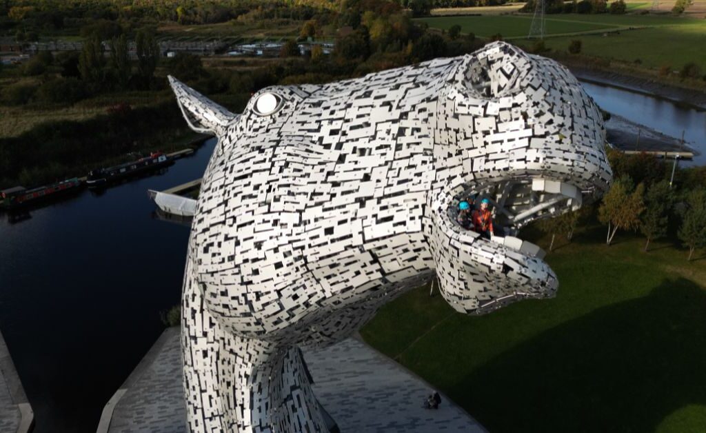 two people looking out of the mouth of one of the Kelpies as part of the Kelpies Experience