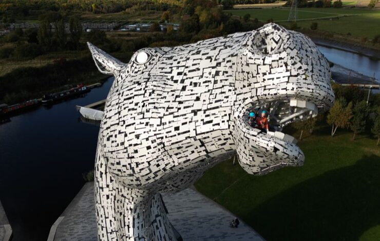 two people looking out of the mouth of one of the Kelpies as part of the Kelpies Experience