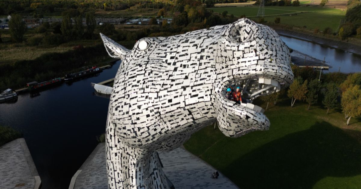 two people looking out of the mouth of one of the Kelpies as part of the Kelpies Experience