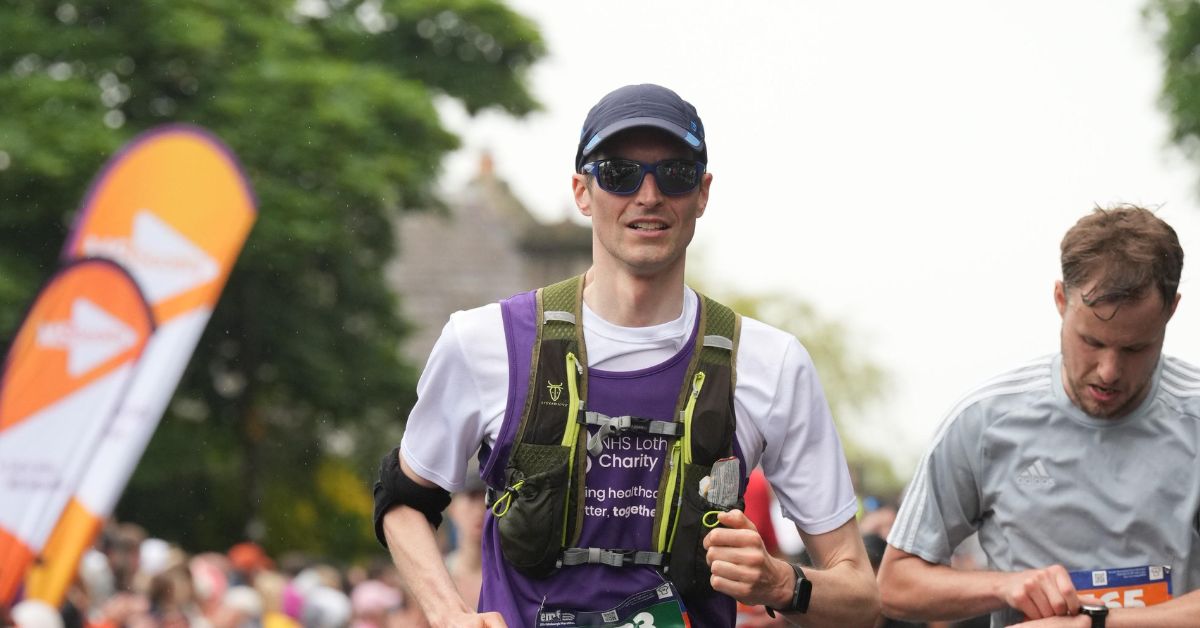 EMF runner, Neil, running past the crowds
