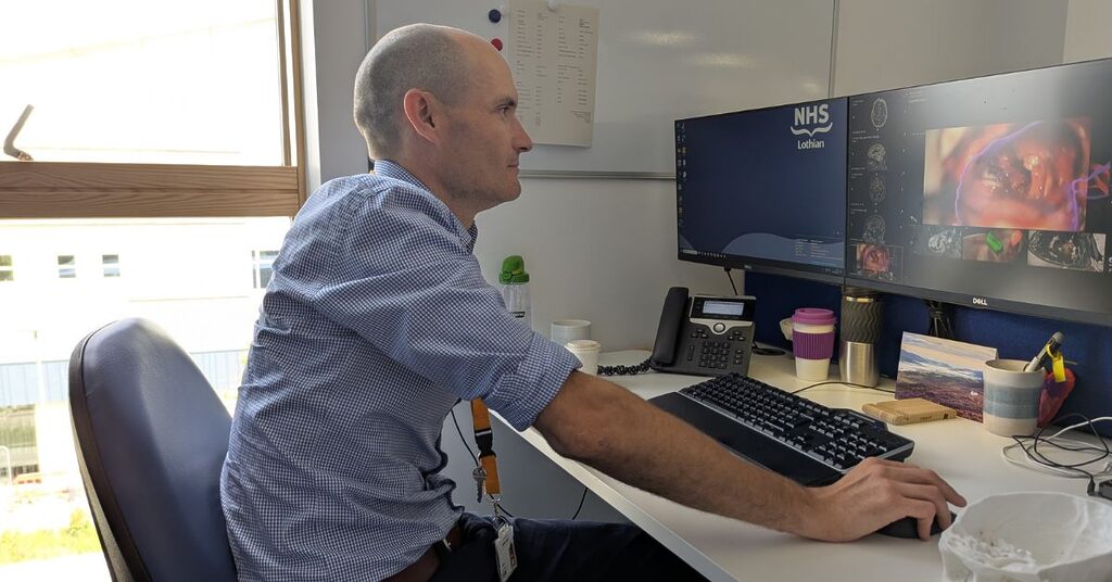 Mr Anthony Wiggans using the brainlab software on a computer