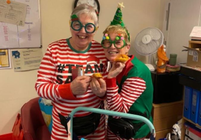 Staff dressed up in Christmas outfits