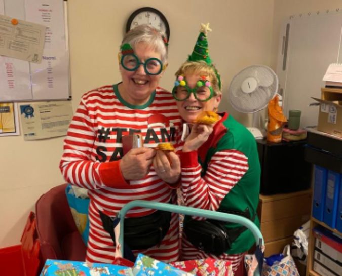 Staff dressed up in Christmas outfits