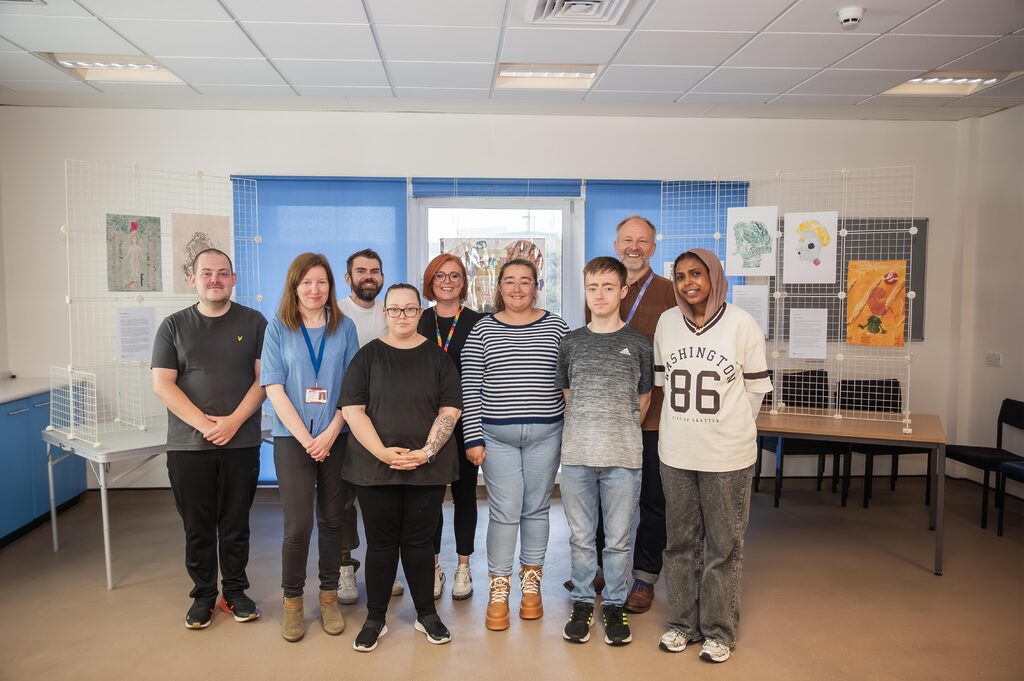 Young adults in front of artwork