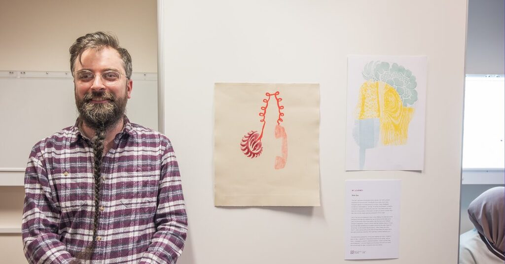 Male Young Adult with his artwork