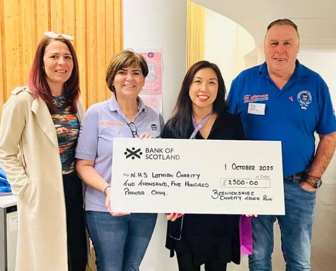 Presenting a cheque for money raised through the Berwickshire Charity Truck Run