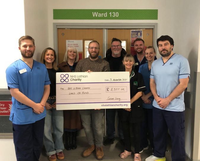 Callum Laing presenting a cheque to NHS Lothian staff
