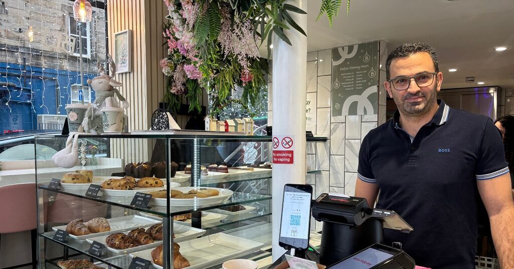 Fadi Bacheet, owner of Bliss House Cafe, standing behind the counter