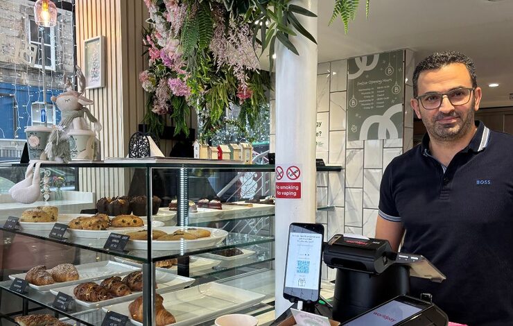 Fadi Bacheet, owner of Bliss House Cafe, standing behind the counter
