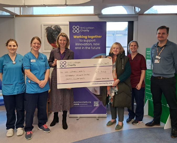 Lorna Rankine presenting a cheque to NHS Lothian staff