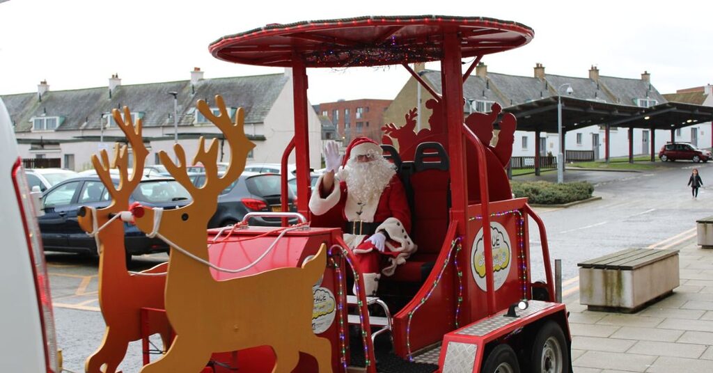 the FACE sleigh with Santa waving