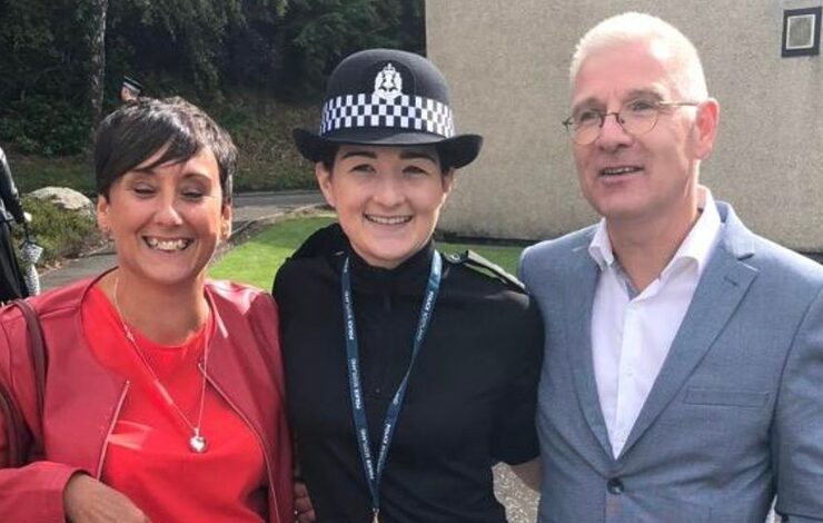 Natalie in her police uniform alongside her family.