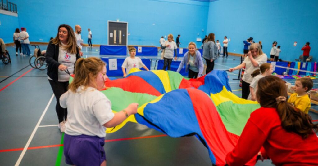 participants playing with the parachute