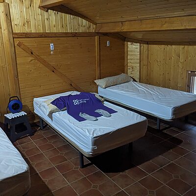 NHS Lothian Charity t-shirt and walk wear laid out on a bed