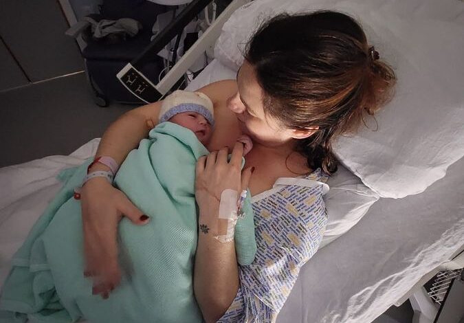 Giada holding her son Harrison after giving birth