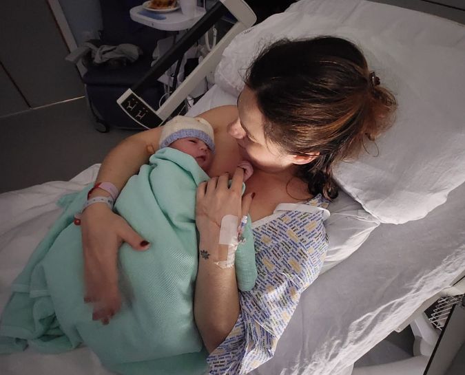 Giada holding her son Harrison after giving birth