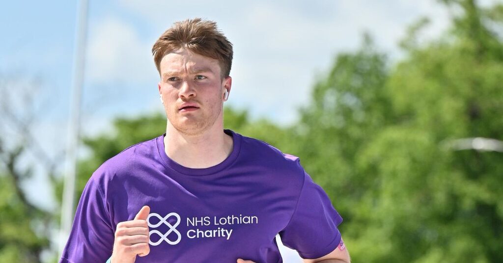 Alexander Ferguson running the marathon at the Edinburgh Marathon Festival wearing an NHS Lothian Charity t-shirt