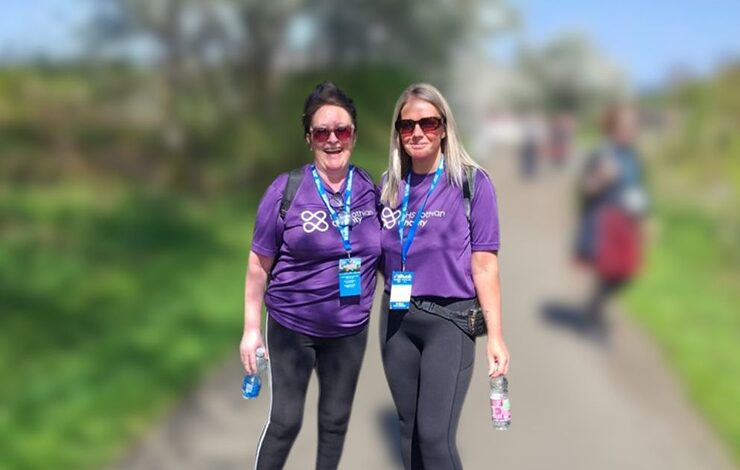 Carly and Bev smiling at the camera in NHS Lothian Charity t-shirts