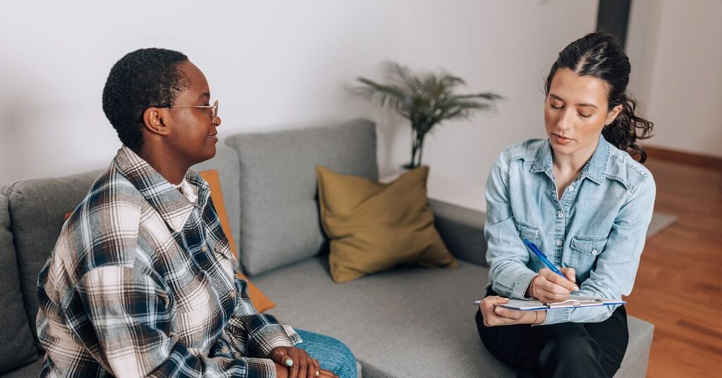 two people talking in a consultation room