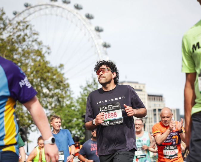 Shaurya Abhi running the TCS London Marathon with the London Eye in the background