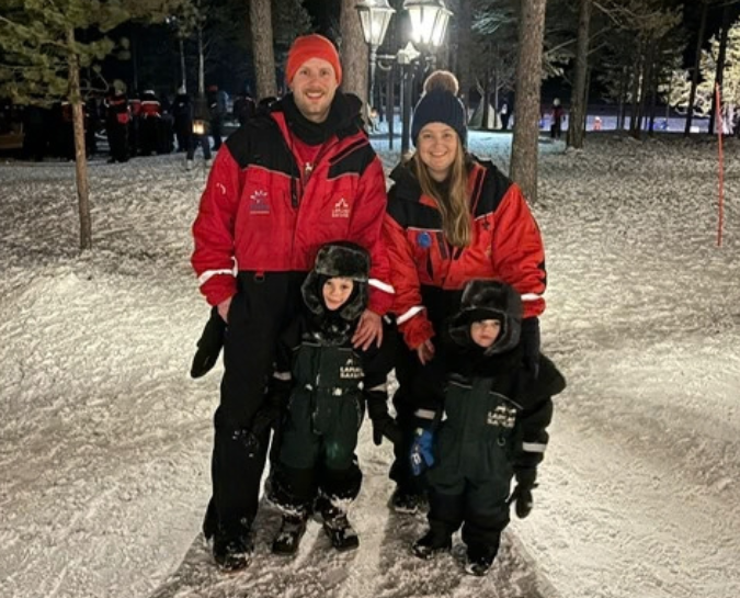 a family in snowsuits in Lapland