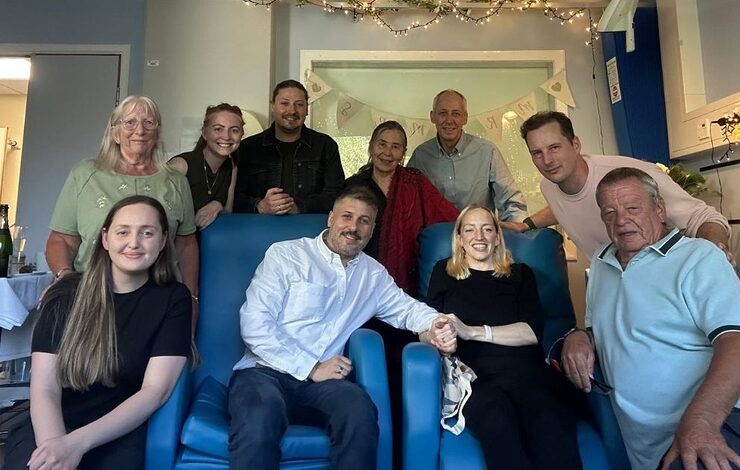 Babs and Nik with their friends and family at their wedding in the Edinburgh Cancer Centre