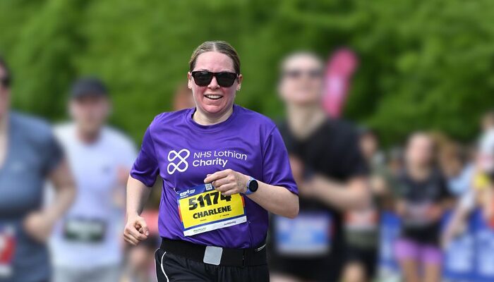 Charlene Kay running the Edinburgh Marathon Festival in her NHS Lothian Charity t-shirt